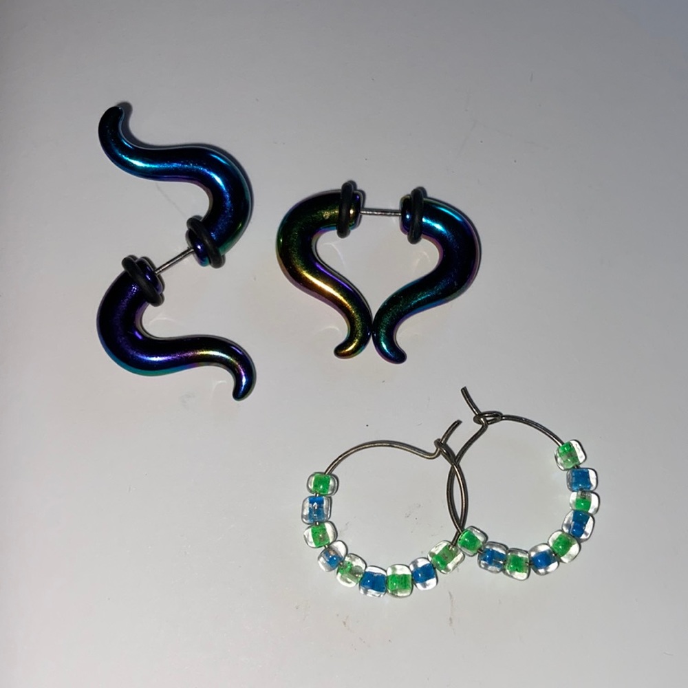 a pair of fake plugs/tapers and small beaded hoop earrings